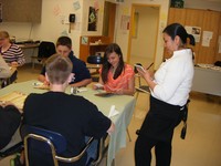 Students place orders in Spanish with guest speaker Rafaela of La Lupita Restaurant Students place orders in Spanish with guest speaker Rafaela of La Lupita Restaurant